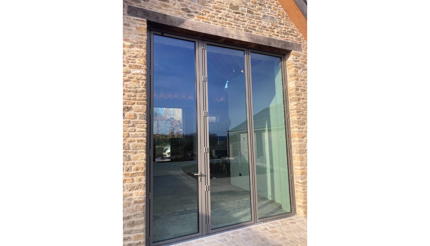 Just under 4m tall bifolding IQ Glass doors