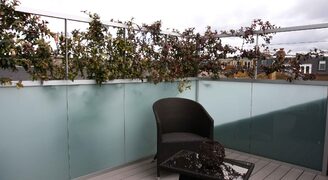 Sandblasted structural glass balcony