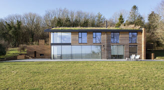 New build country home with sliding glass doors and aluminium casement windows