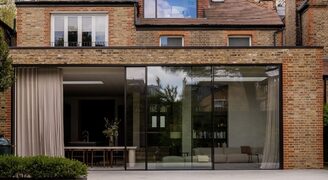 modern extension with floor to ceiling sliding glass doors