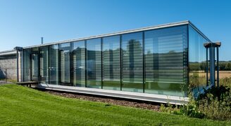 floor to ceiling structural glass walls with a casement door