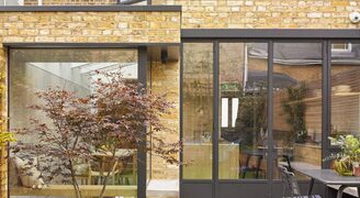 listed townhouse extension in Hackney with steel framed glazing