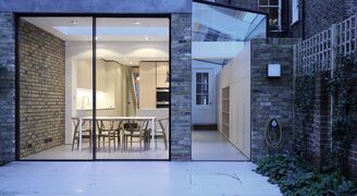 Slim glass patio doors with frameless glass side infill extension