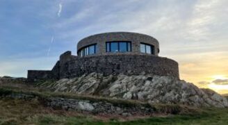 Circular coastal home with marine grade glass to sea views.