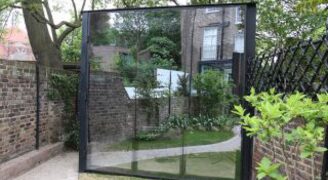 Oversized glass mirror door to garden room