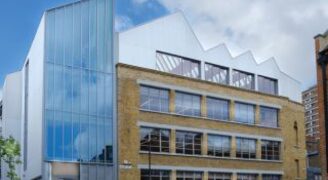 an external street view of an old warehouse which has been converted into offices with a sustainable design