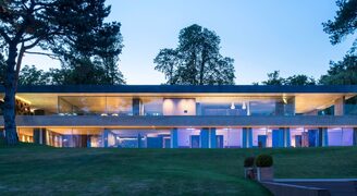 luxury villa in Switzerland with slim sliding glass doors and frameless glass balustrades