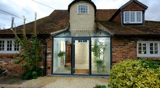 Glazed reception to Grade II listed dwelling.