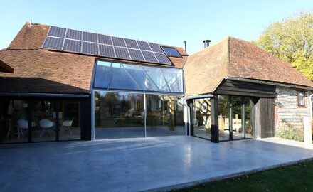 super slim framed sliding glass doors in a barn conversion