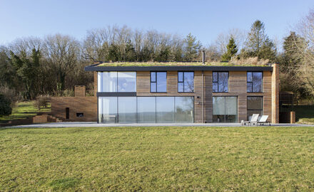 New build country home with sliding glass doors and aluminium casement windows