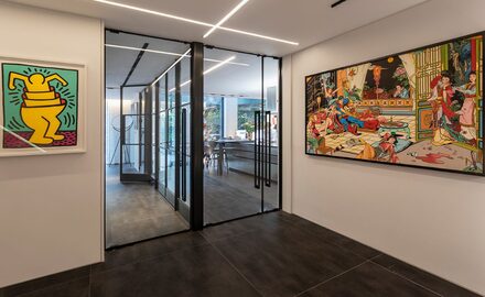 internal glazing systems help to create an open-plan interior design