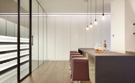 interior glazing to home bar to create a wine cellar