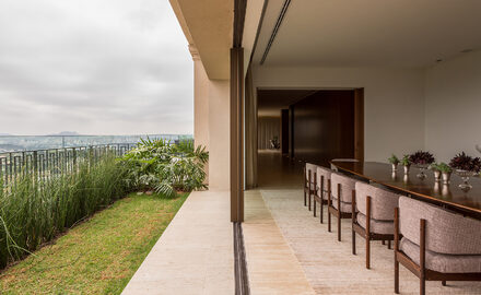 Minimal sliding glass doors to large dining area