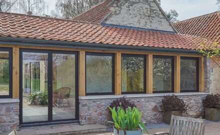 traditonal barn conversion with metal framed glazing