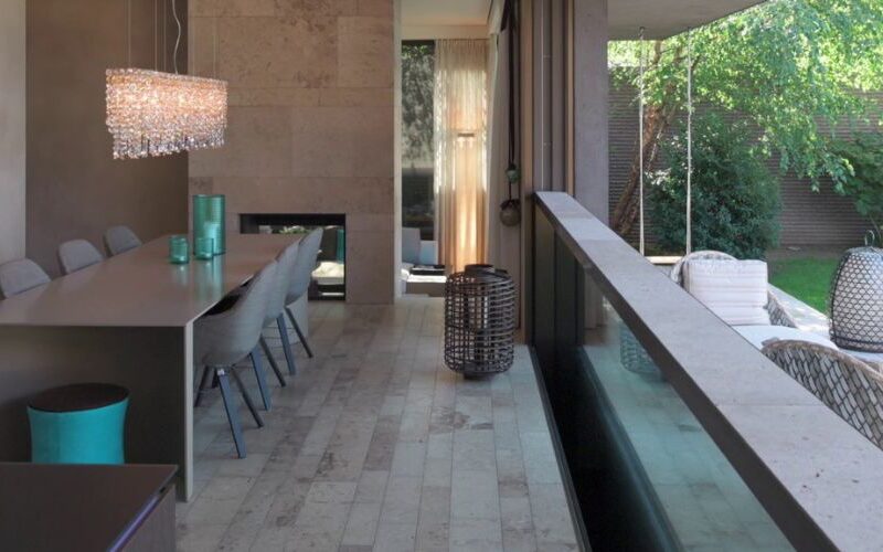 a descending window sinking below the floor of a house extension