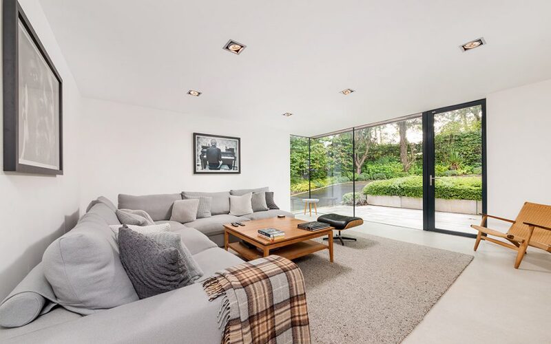 cosy living room with large glass wall and door