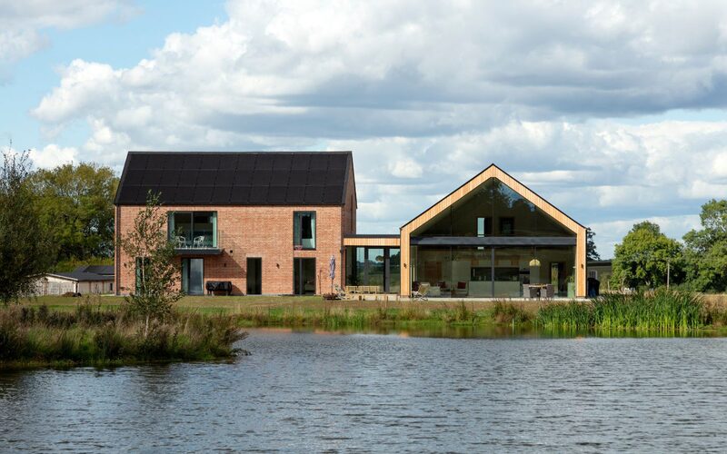 large modern farmhouse in leicester overlooking a lake