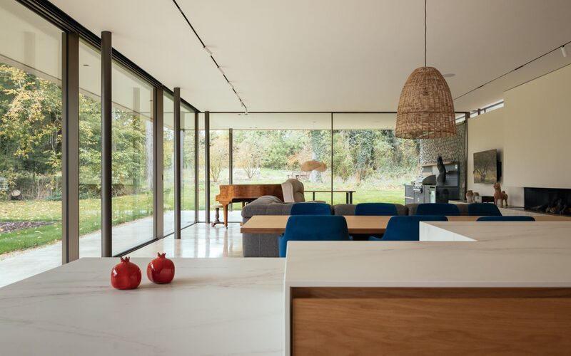 Floor to ceiling slim frame sliding glass doors at Clayworth House