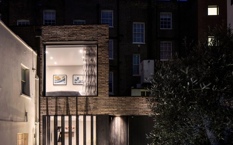 an infill house in London with large frameless windows