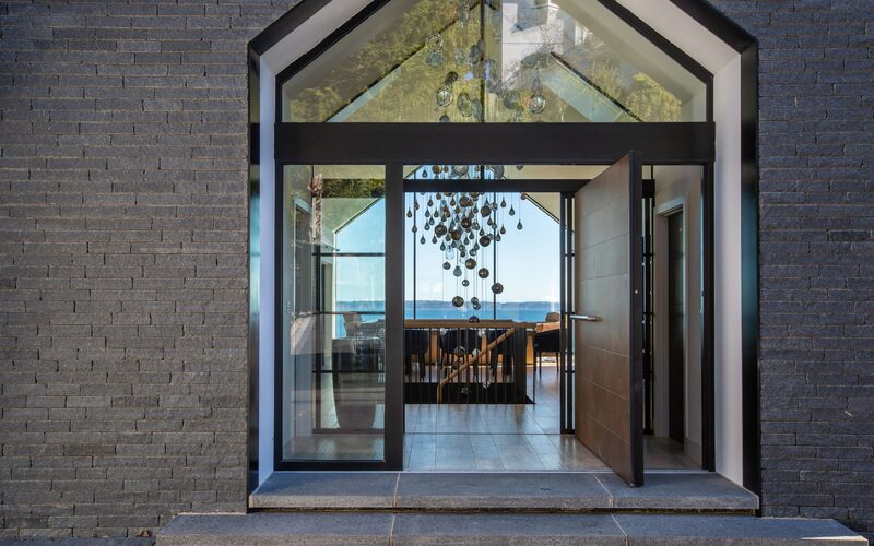 a glazed entrance to a modern coastal home