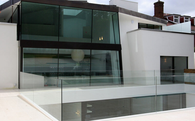 Structural glass facade and sunken basement with glass balustrades