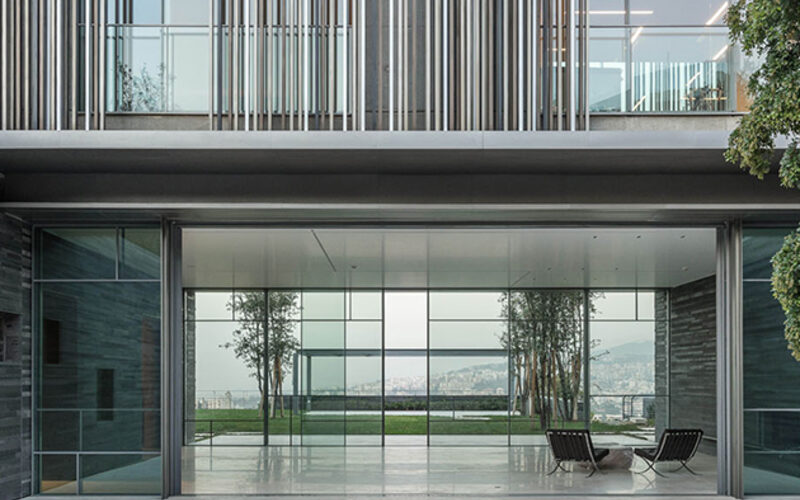 Minimal sliding glass doors to entrance lobby of luxury international home