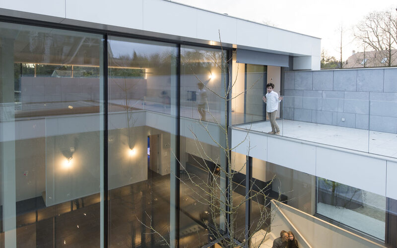 Double height sliding glazed facade