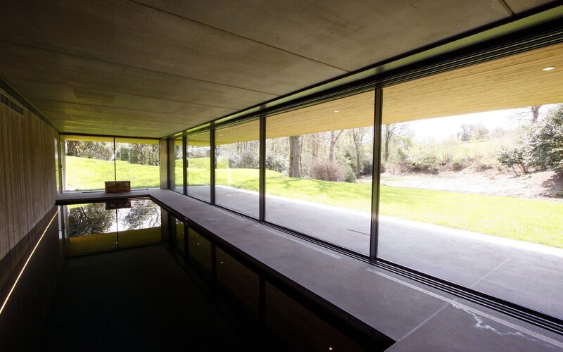 Marine grade glazed slim sliding doors in pool at Sweethaws