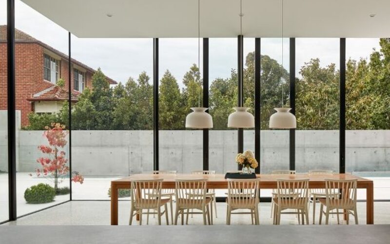 minimal dining room with fully glazed walls