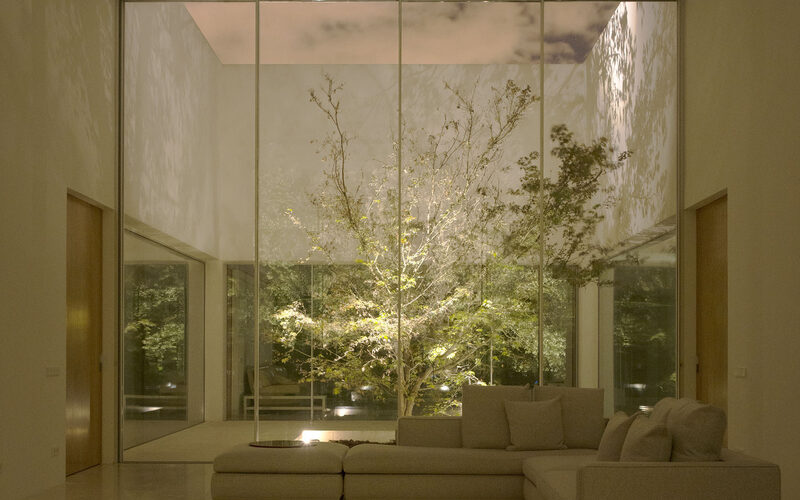 Large sliding glass doors to internal garden courtyard