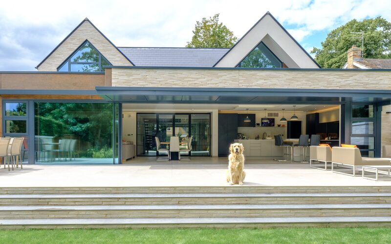 modern house in Cambridgeshire with permeable glass walls makes for a dog friendly home with easy access to the patio and garden.