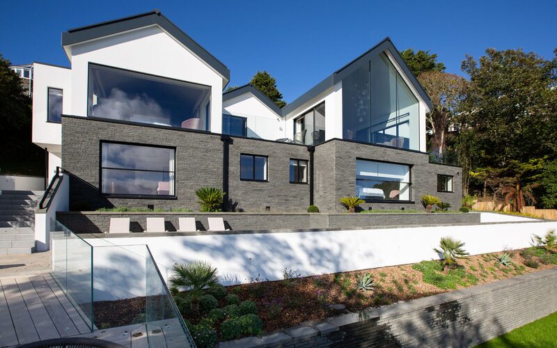 modern house with sloping roofs on cliffside