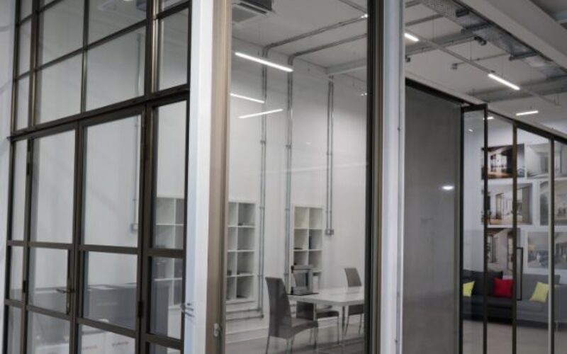 oversized pivot door glazing showroom