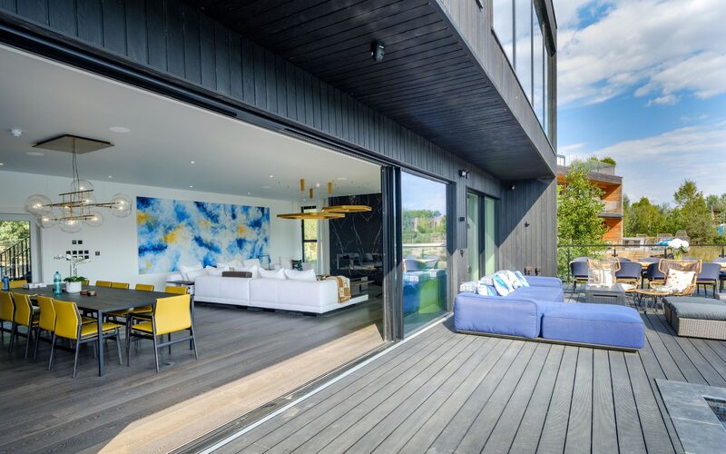 sliding glass doors in lakefront new build home