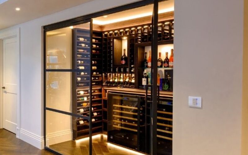 internal glass doors around a wine cellar with glazing bars for a steel look design