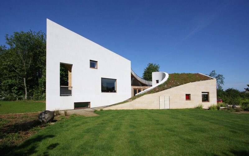 sustainable home in rutland waters with two wings and green roof