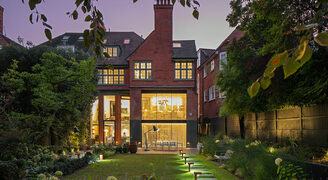 Minimally framed sliding glass doors to rear facade of historic london home