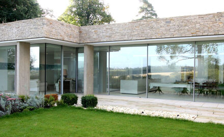 minimally framed sliding glass walls in luxury new build home