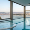 sinking glass walls to a swimming pool